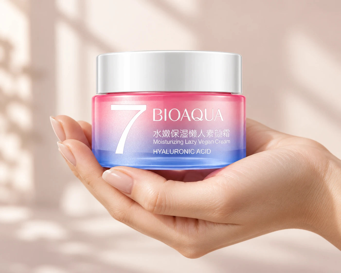 Hand holding BIOAQUA V7 pink and blue cream jar